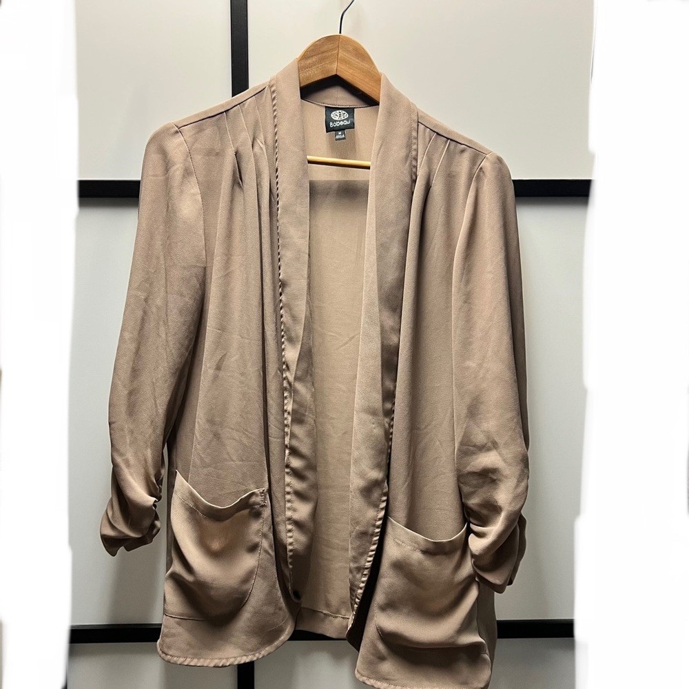 Sheer blazer in light tan.